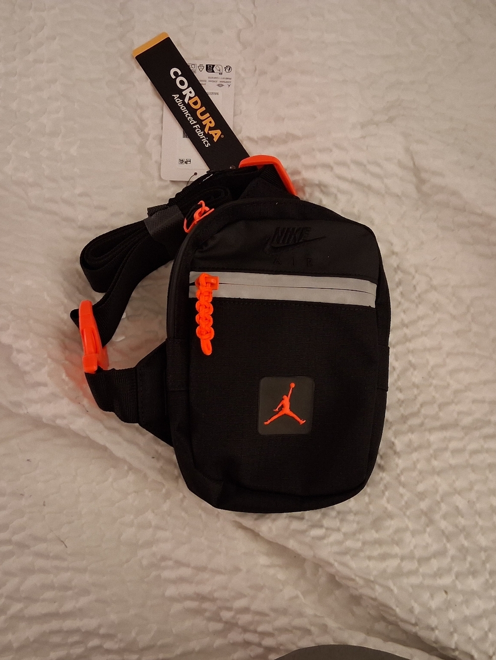 Jordan Black Sling Bag with Bright Orange Details